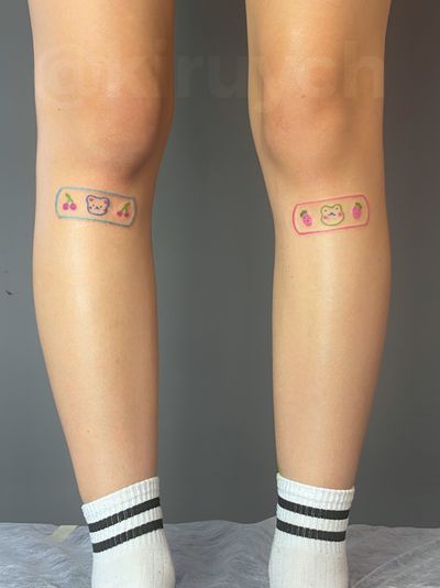 Cute bandaids (kids drawing style) under knees