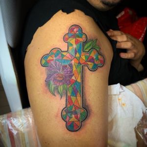 Cross tattoo, colored tattoo, orchids IG @danyink3 to follow. #worldfamouseink #tattoo #tattooideas #tattoodesign