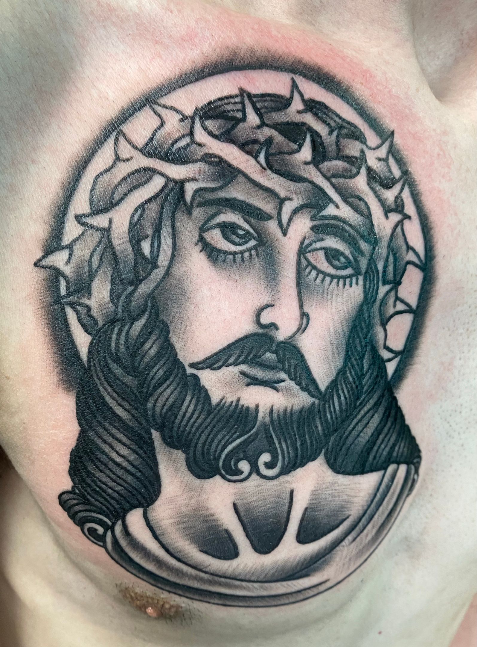 Black Ink Jesus Head Tattoo On Right Forearm