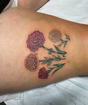 Marigold and carnation tattoos