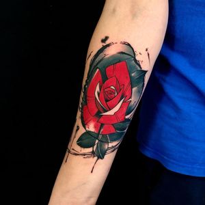 Vibrant new_school style flower tattoo on forearm by talented artist Sandro Secchin. Stand out with this beautiful and unique design!