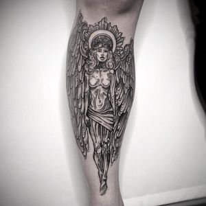 Elegant black and gray fine line tattoo of a angelic woman with wings on the shin by Lamat. Graceful and intricate design.