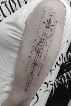 Elegantly detailed pattern tattoo on upper arm by the talented Mary Shalla. Delicate and unique design.