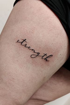 Elegant small lettering piece on upper leg, beautifully crafted by talented artist Mary Shalla.
