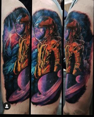 Experience the dreamy universe of Frankie Brown's surreal watercolor art on your upper arm with a mesmerizing planet and astronaut design.