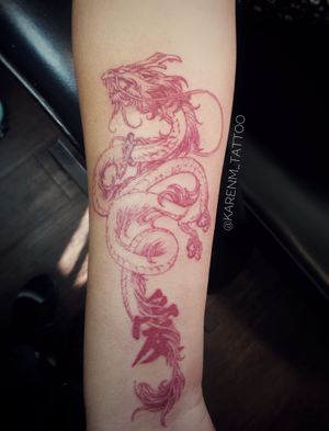 Red #chiesedragon #dragon with character “love” On forearm 