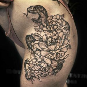 Hip floral snake tattoo 