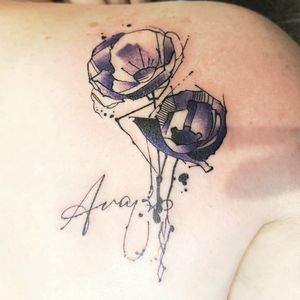 Violet poppies for my daughter.Tattoo done by: Bob Hunt