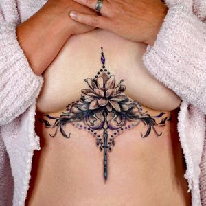 Lotus and filigree sternum tattoo by Andreanna Iakovidis #sternumtattoo #ornamentalchesttattoo #lotus 
