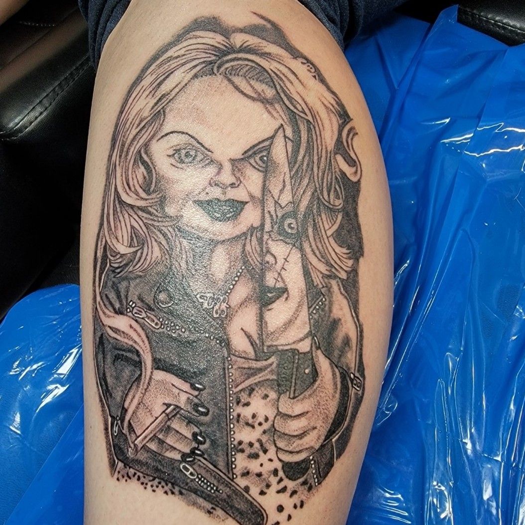 Grey Ink Chucky Tattoo On Leg