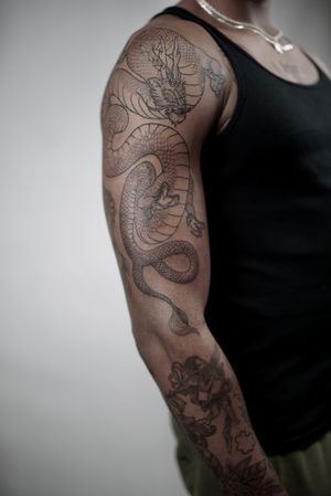 Black and white half sleeve tattoo inspired by cleveland browns, harry  potter, and xbox on Craiyon