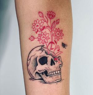 Ignorant style forearm tattoo featuring a delicate flower, skull, and fly design by Galen Bryce (aka Drip Skull).
