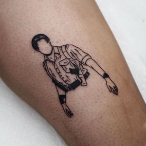Illustrative blackwork pistol tattoo on forearm inspired by Brendan Fraser's iconic roles.
