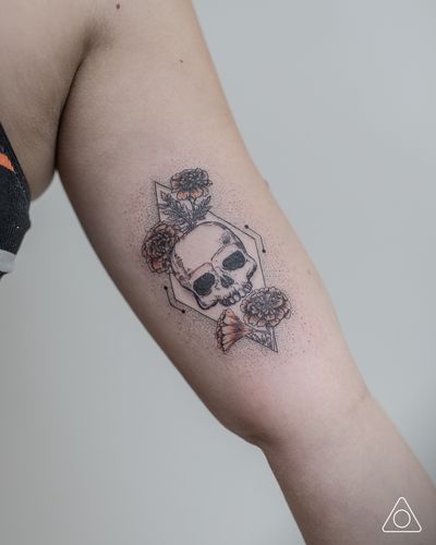 Diamond shaped coffin with skull and marigold flowers