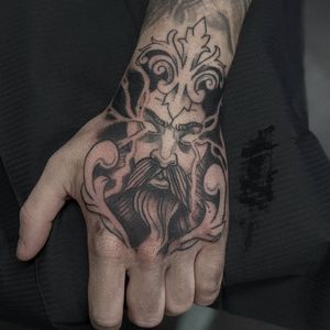 Get a powerful Zeus eye design on your hand by tattoo artist Luca Salzano in black and gray or fine line style.