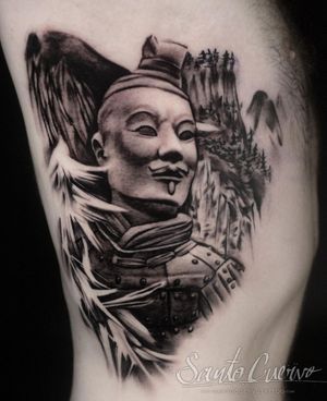 Elegant black and gray statue tattoo on ribs, showcasing Alex Santo's mastery of blackwork. A timeless and powerful piece of art.