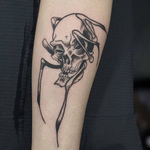 A striking black and gray fine line tattoo of a spider intertwined with a skull, skillfully done by Luca Salzano.