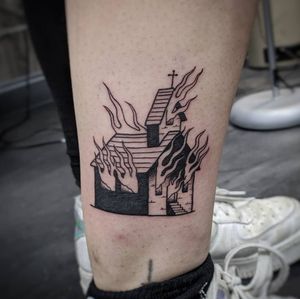 Explore the depths of darkness with this blackwork fine line tattoo of a church engulfed in flames by Luca Salzano on your lower leg.