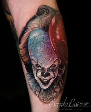Capture the chilling essence of Pennywise with this stunning lower leg tattoo by artist Alex Santo.