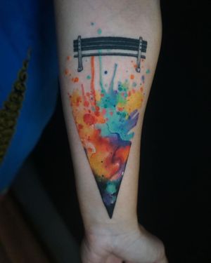 Experience Aygul's artistry with a stunning watercolor bench tattoo, beautifully crafted on your forearm.