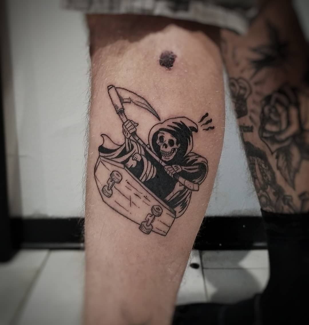 Small skateboard tattoo on the left forearm.