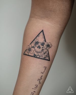 Triangular skull tattoo