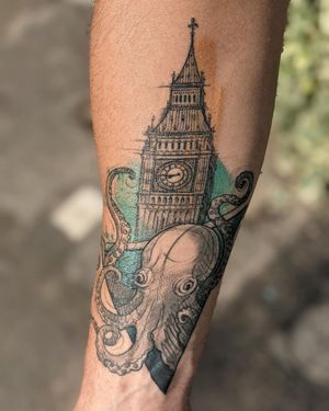 Intricate black and gray design featuring an octopus, tower, Big Ben, and watch on the forearm. Created by Aygul with delicate sketchwork details.