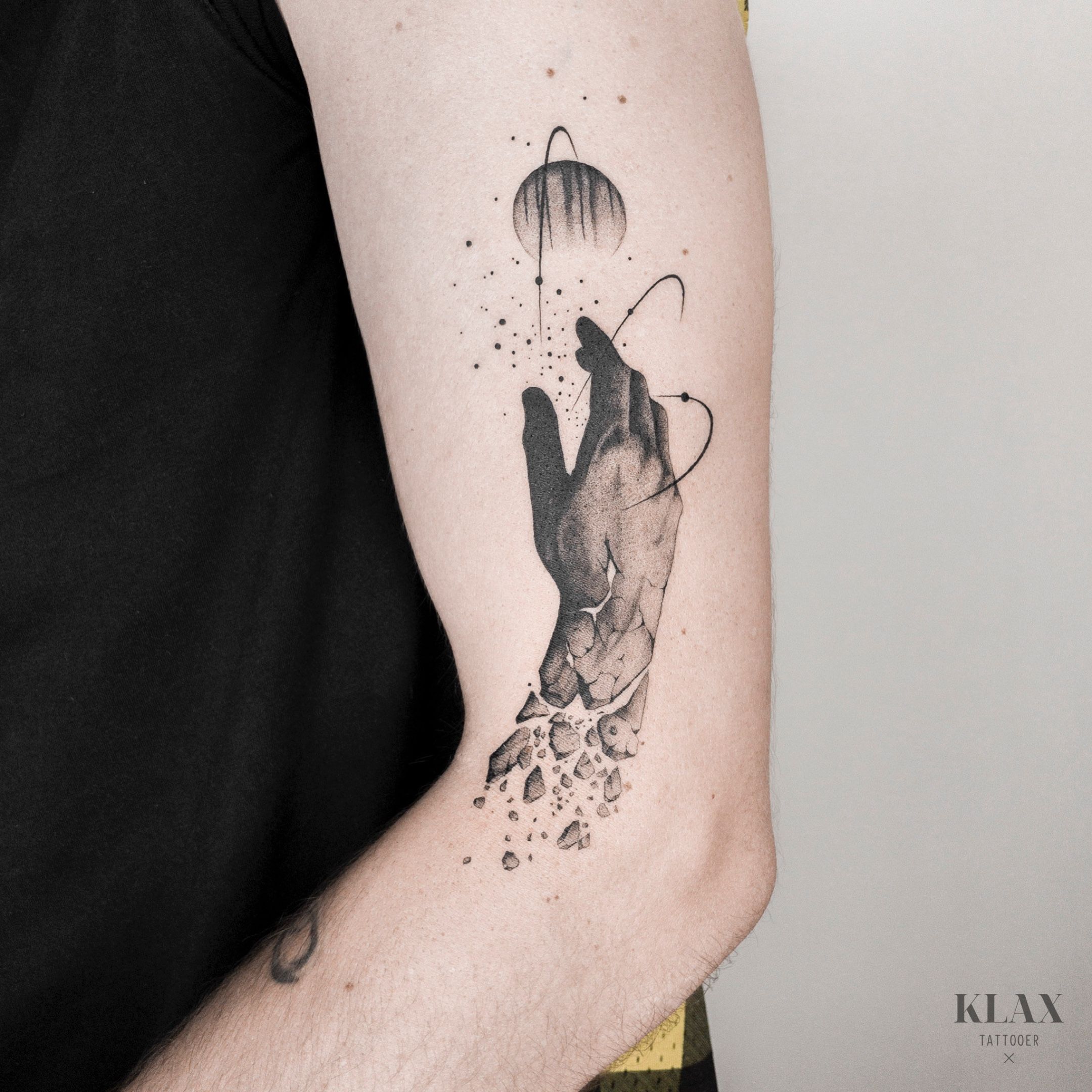 Person hand reaching calm water with dreamcatcher tattoo photo  Free Tattoo  Image on Unsplash