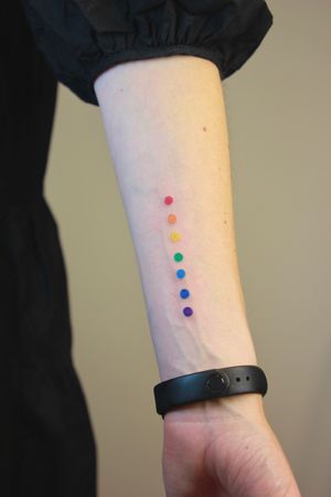 Minimalistic chakras as dots tattoo