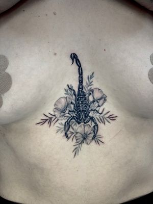 Scorpion with California poppies
