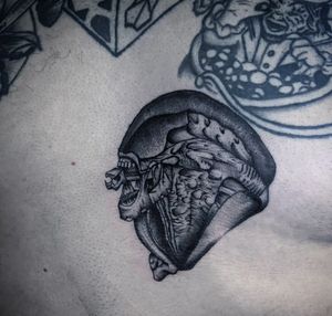 Get a hauntingly detailed black and gray alien xenomorph tattoo by the talented artist Nat.