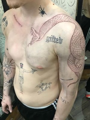 Adorn your shoulder with a striking blackwork snake design by tattoo artist Frankie Brown.