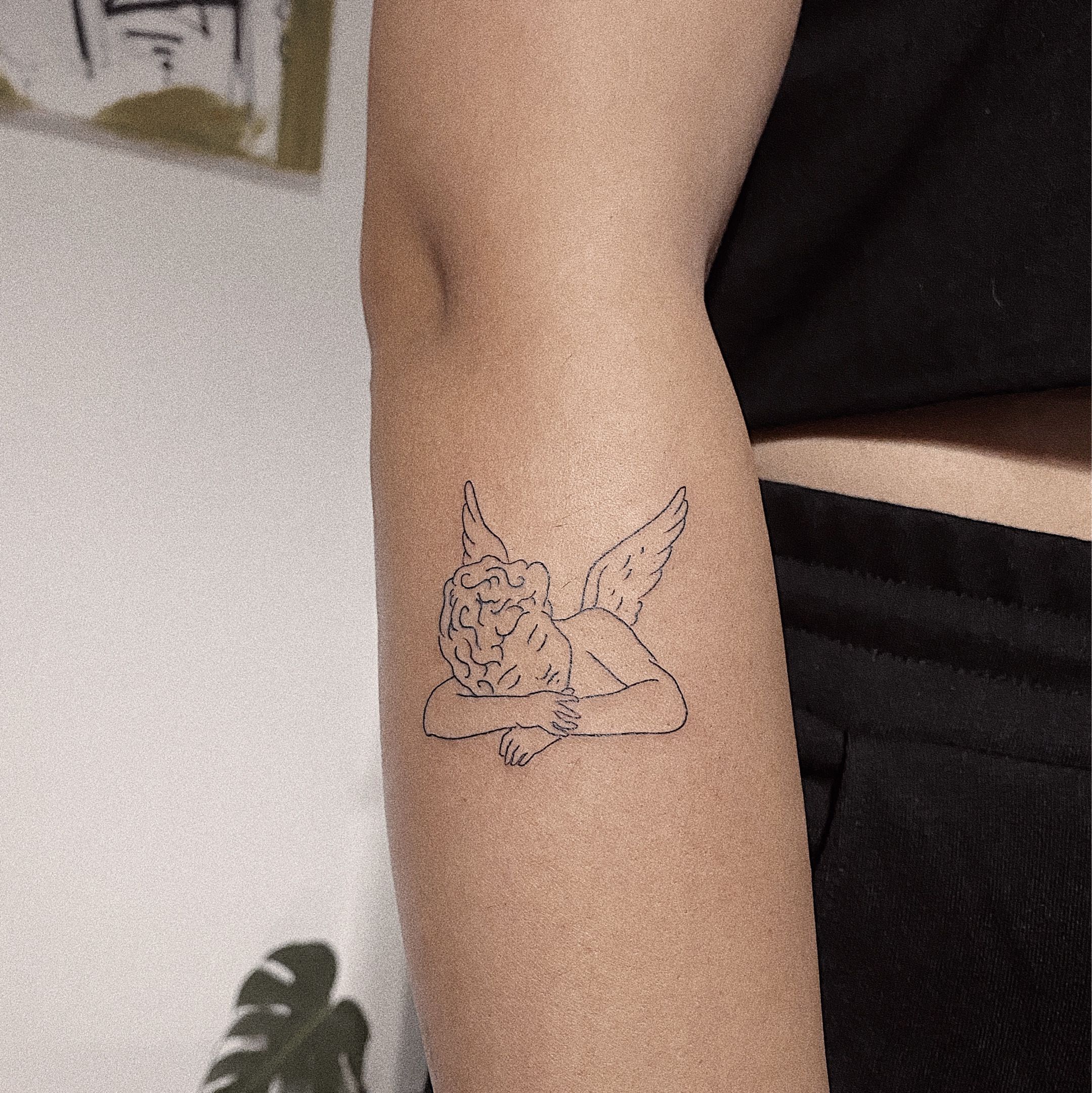 Angel sleeping on shoulder tattoo  hautedraws