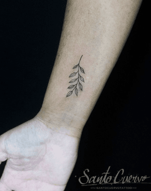 Get a delicate and detailed sprig design tattooed on your forearm in London, GB. Perfect for minimalist tattoo lovers.