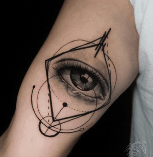 Get a mesmerizing realism eye tattoo on your upper arm in London by top artists.