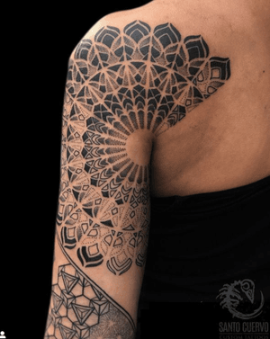 Experience intricate dotwork mandala design on your upper arm in London. Perfect blend of geometric and spiritual elements.