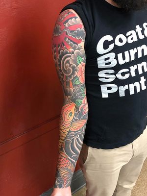 Enhance your sleeve with a stunning koi fish design crafted by Shawn Nutting. Dive into a world of symbolism and beauty.