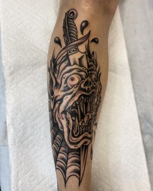 Get a fierce blackwork dagger and monster tattoo on your forearm in Los Angeles for a bold and edgy statement.
