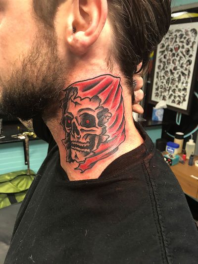 Traditional style tattoo by Shawn Nutting featuring a menacing skull and grim reaper motif on the neck.