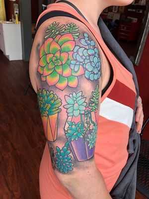 This stunning illustrative flower tattoo by artist Shawn Nutting is the perfect addition to your arm. Embrace the beauty of nature with this intricate design.
