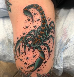 Traditional style scorpion motif tattoo on upper arm, expertly done by artist Shawn Nutting.