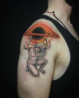 Illustrative tattoo featuring a sun, planet, and woman on upper arm in London, GB.