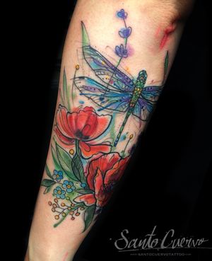 Beautiful watercolor design with a dragonfly, flower, and sketchwork by talented artist Aygul. Perfect for a unique and artistic forearm tattoo.