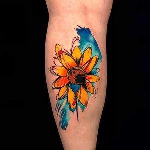 Get a beautiful illustrative sunflower tattoo on your lower leg in London, GB. Stand out with this unique design!