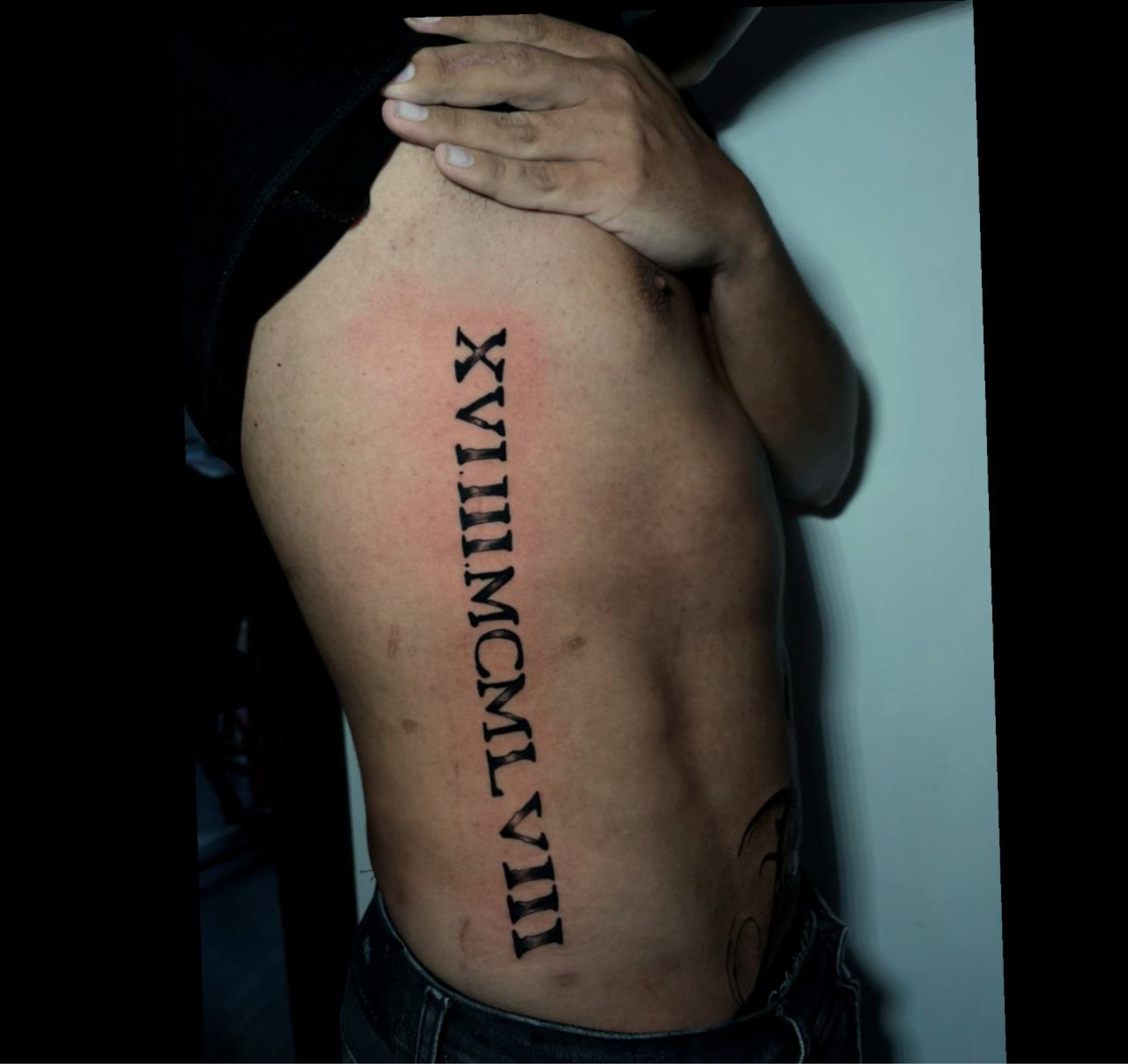 Roman numeral date tattoo on the rib cage  Tattoogridnet