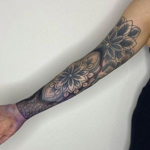 Get a stunning geometric mandala tattoo on your forearm in London, perfect for a modern and intricate design.