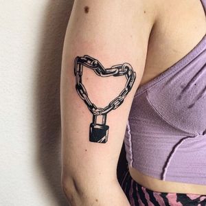 Capture your love and loyalty with this stunning neo-traditional tattoo featuring a heart, chain, and padlock on your upper arm in London, GB.