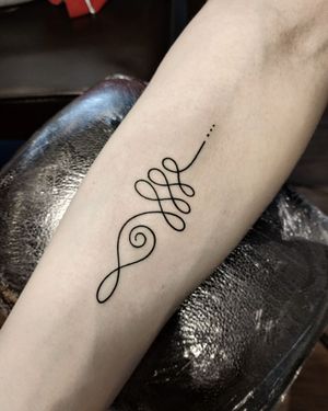 Elegant and symbolic unalome design on forearm, expertly executed in fine line style by talented artist Mary Shalla.