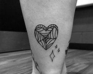 Get a unique illustrative heart tattoo on your ankle in London. This geometric design will make a statement. Book now!