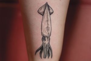 Get inked with a stunning illustrative squid design on your forearm in London. Stand out with this unique and eye-catching tattoo!